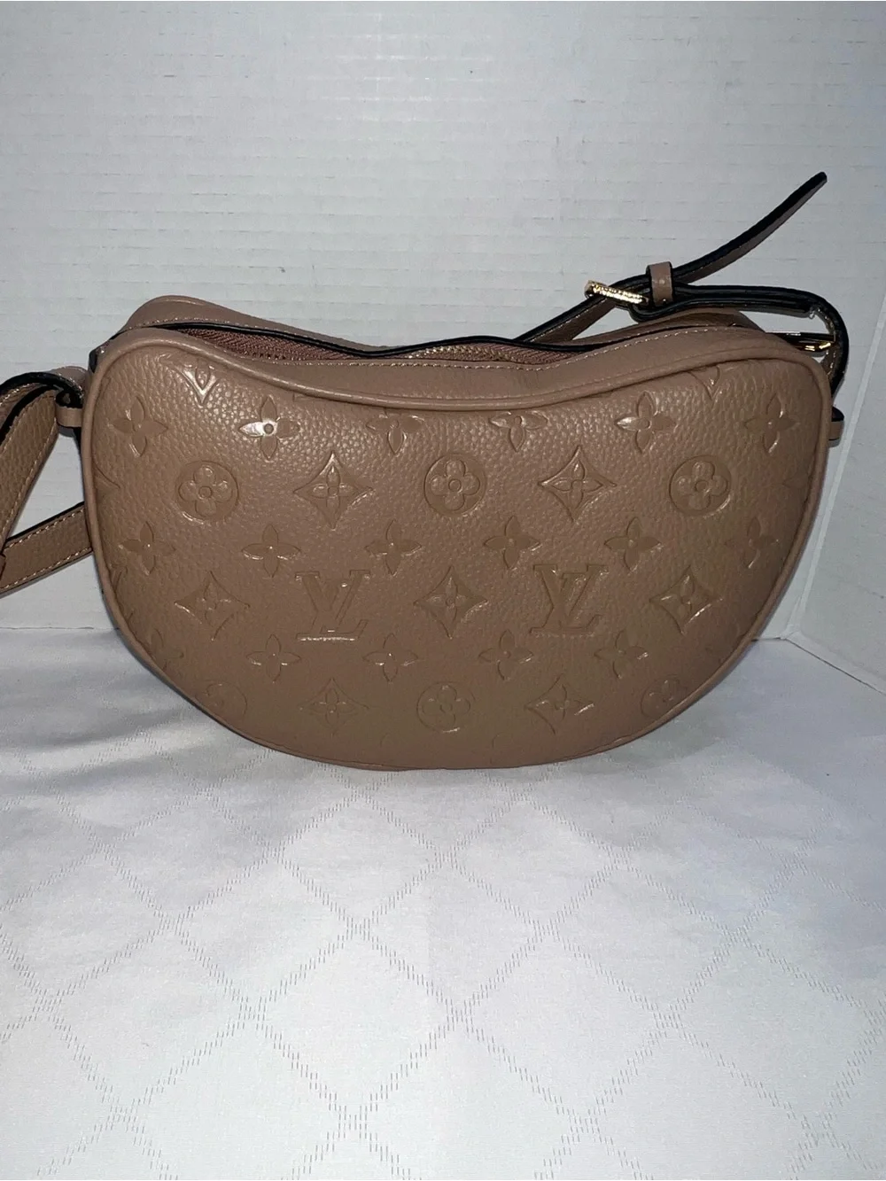 Designer inspired half-moon shoulder bag in a neutral taupe leather w/monogram